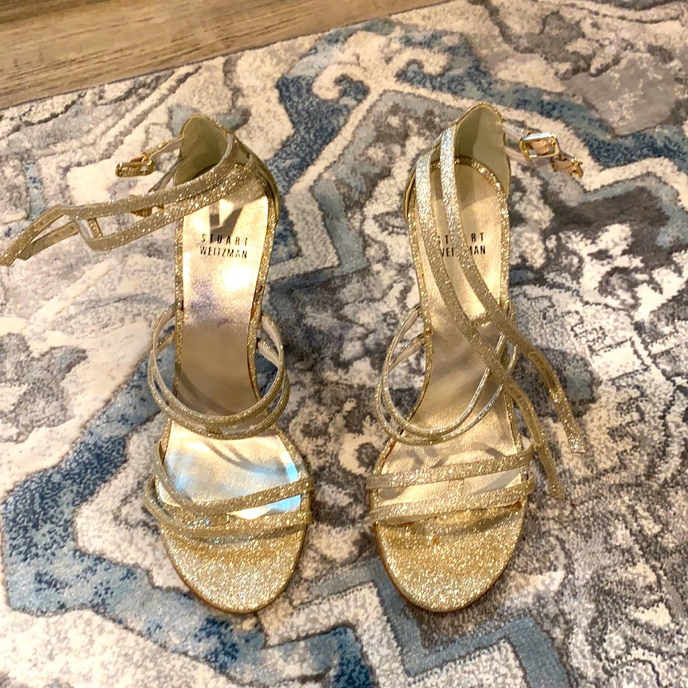 Gold high heel shoes